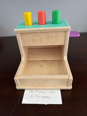 Lovevery Wooden Pop Toy with Yellow, Red, Green Pegs
